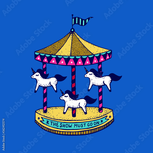 Multi-colored carousel with unicorns. The show must go on