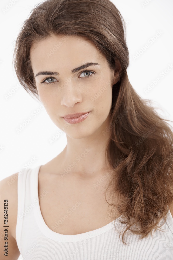 Beautiful young white woman against white background. Beautiful young white woman against white background.