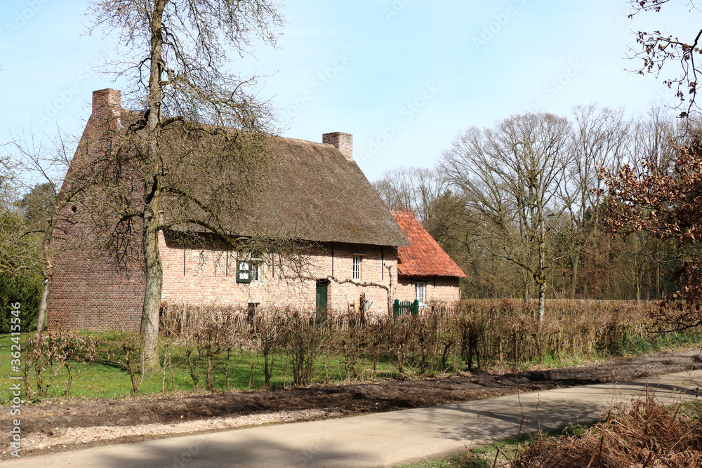 Typical, ancient and historical farmhouse in a rural landscape, Bokrijk, Belgium Typical, ancient and historical farmhouse in a rural landscape, Bokrijk, Belgium