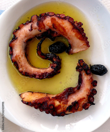 Grilled octopus legs with olive oil in Skala Eressos, Lesvos island, Greece.