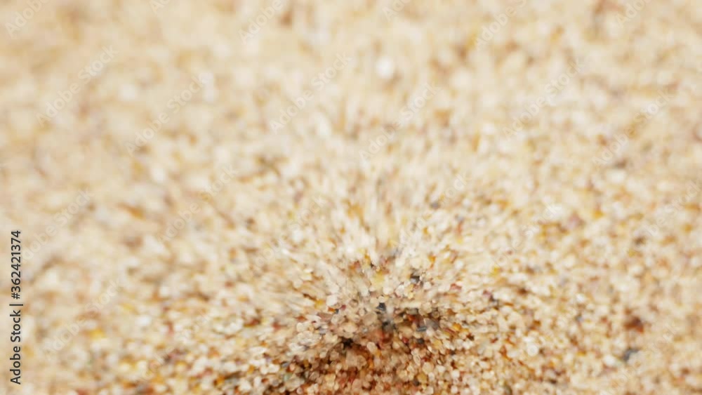 Sand steam and turn. Inside the hourglass, shallow depth of field, close-up. Unusual hypnotic effect Sand steam and turn. Inside the hourglass, shallow depth of field, close-up. Unusual hypnotic effect