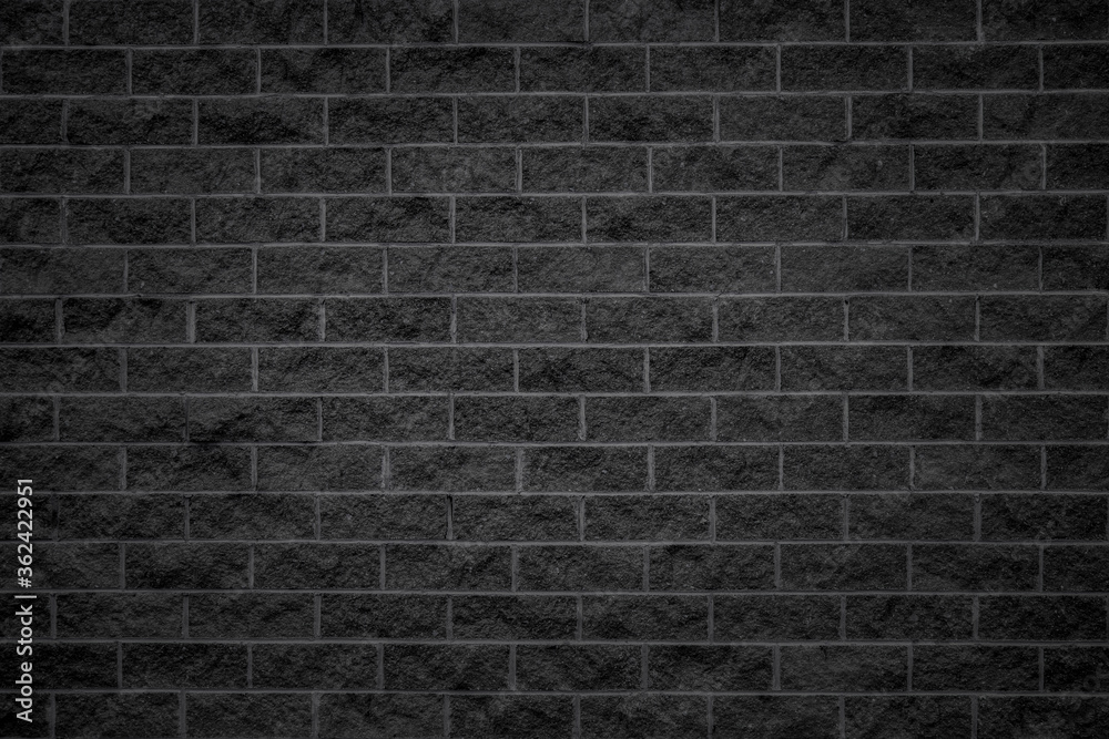 black brick wall, rough masonry wall of black raw brick