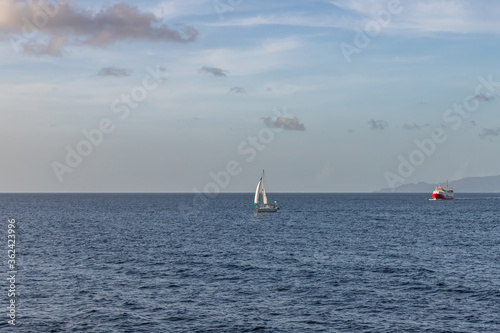 Sailboat and ferry boat at sea in Saint Vincent and the Grenadines