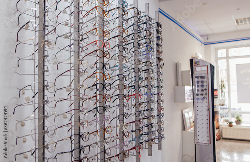 Eyeglasses shop. Stand with glasses in the store of optics.