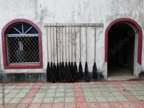 Hanging rubber brooms, Sheshan, Shanghai, China photo
