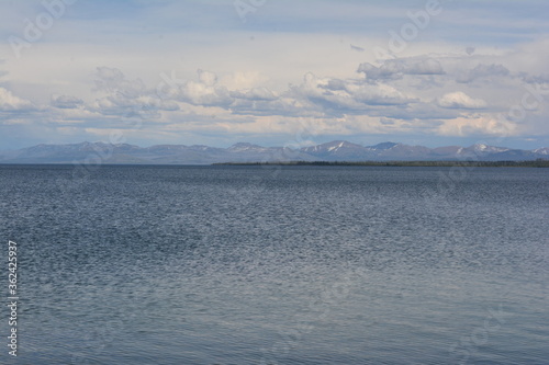 West Thumb of Yellowstone lake (mountains and clouds in background) © Jonah