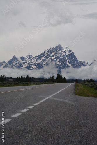 Road to another world. (Flat road in Jackson Hole to the Grand Tetons.)