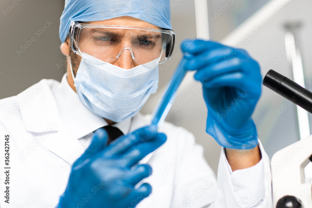 sample of the vaccine in the hands of the researcher . sample of the vaccine in the hands of the researcher .