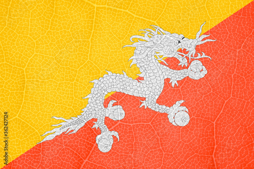 flag of Bhutan on the structure of a tree leaf macro