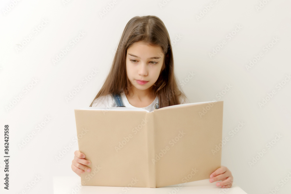 Little girl with a book. Isolated over white background Little girl with a book. Isolated over white background
