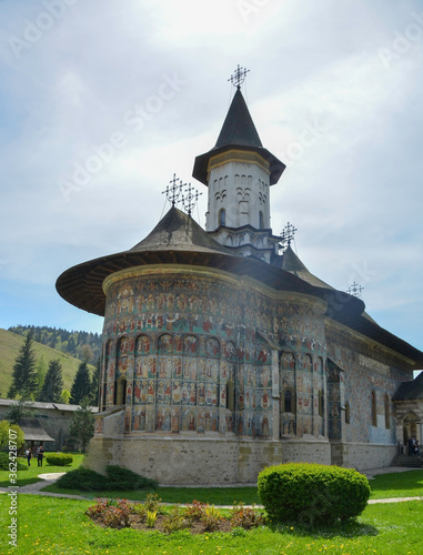 Obraz na płótnie SUCEVITE MONASTERY, BUCOVINA, ROMANIA, EUROPE, SPRING 2018. Orthodox monastery. Moldovan architectural style. Open-air paintings, frescoes and portraits of saints with Byzantine influence. w salonie