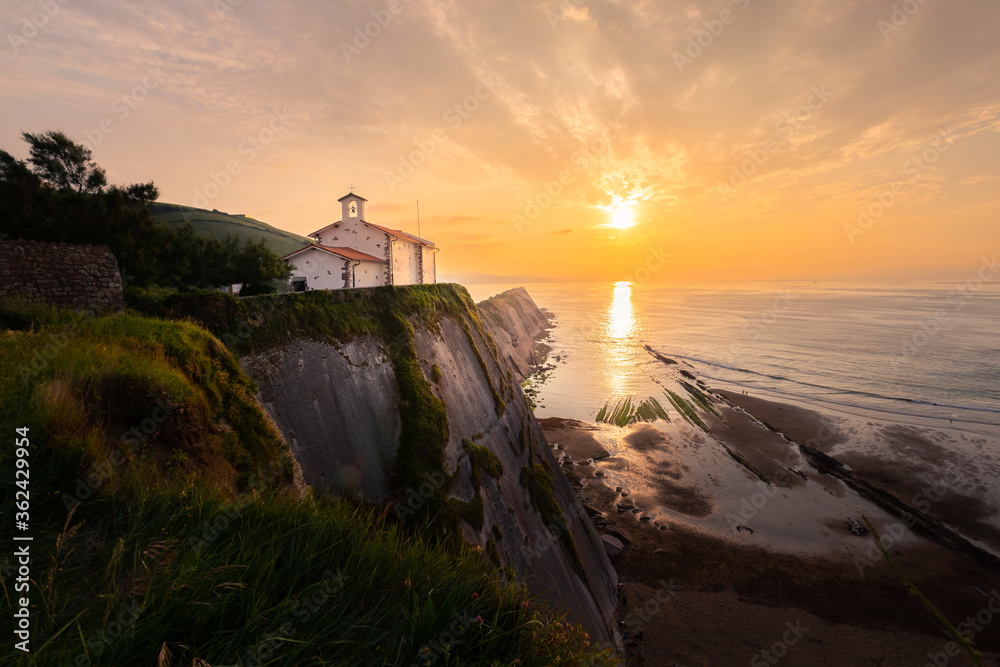 San Telmo ermitage at the top of the cliff of Itzurun beach in Zumaia, Basque Country.