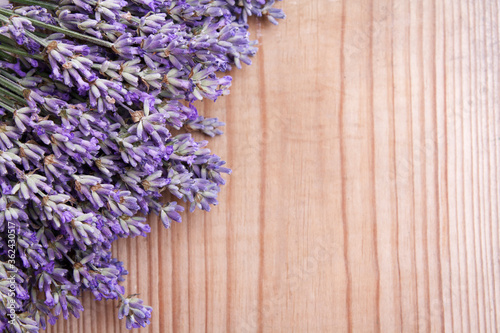 Flat lay lavender flowers on wooden background with copy space