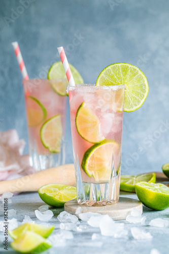 Fresh pink cocktail with lime and grapefruit juice and crushed ice