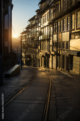Streets of the old city in the rays of a stunning dawn. Porto, Portugal.