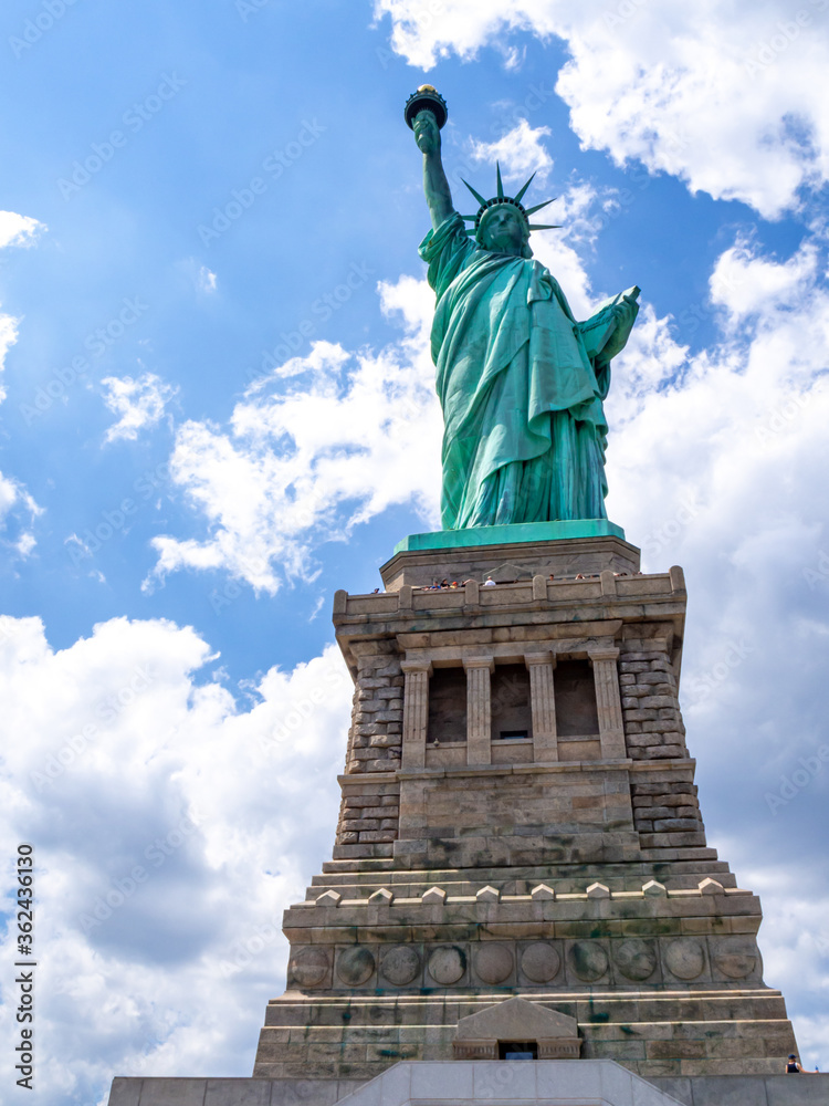 Fototapeta premium close front view of Statue of Liberty in America on a hot summer day