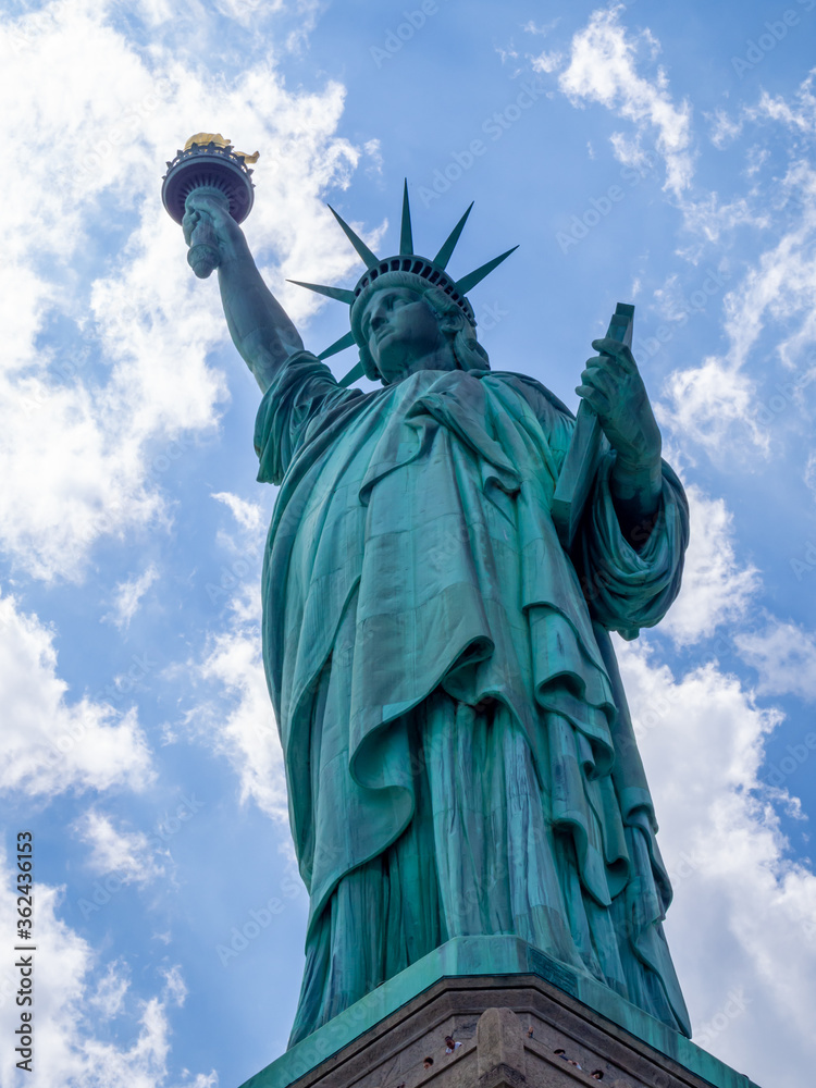 close front view of Statue of Liberty in America on a hot summer day close front view of Statue of Liberty in America on a hot summer day