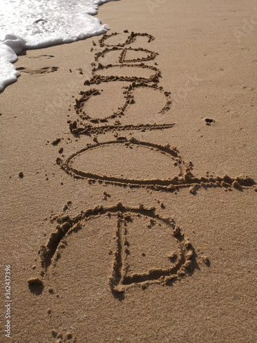"Seaside" written in the sand