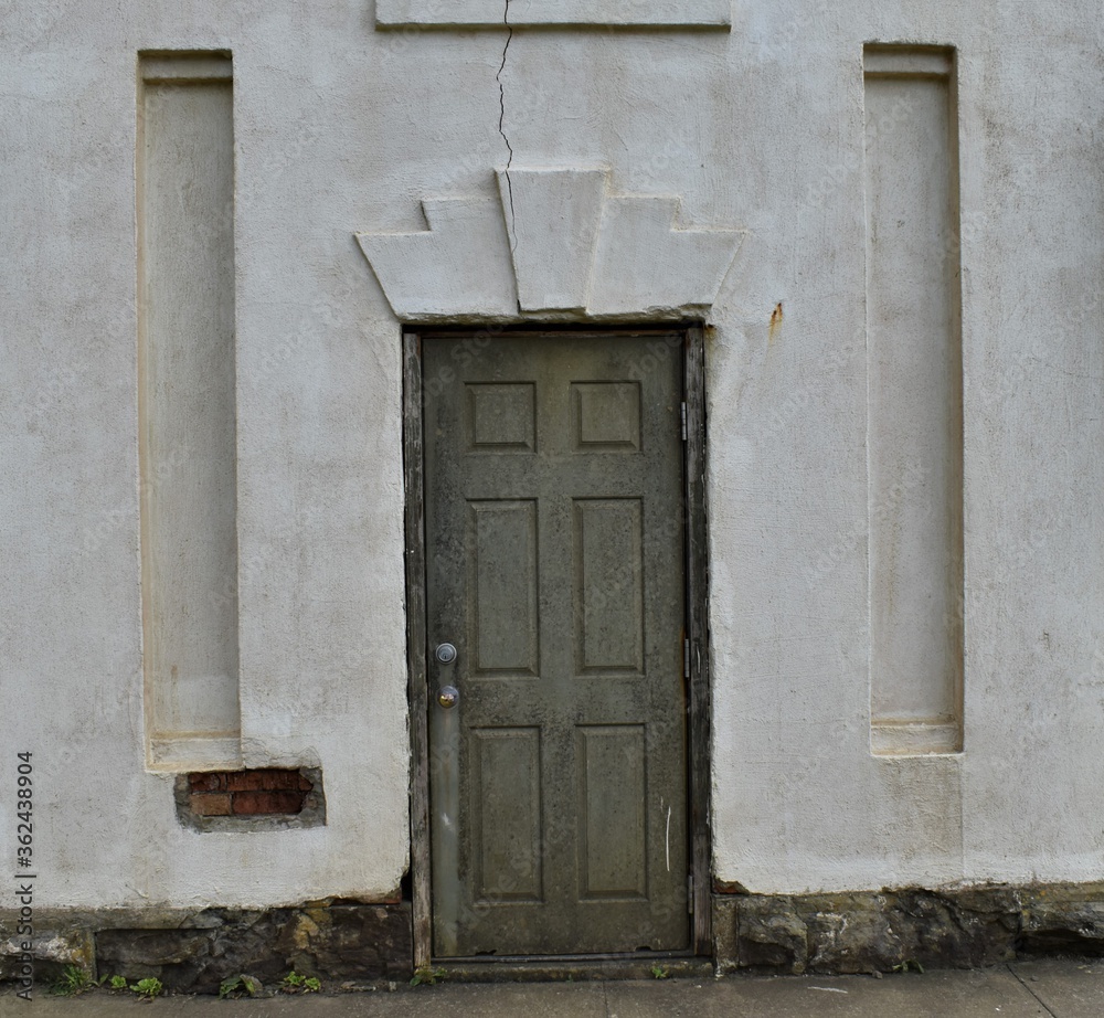 Art deco doorway, antique and rustic.  Cracked plaster.