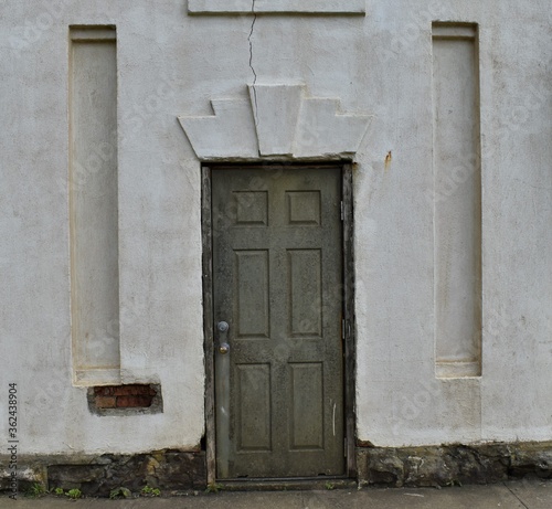 Art deco doorway, antique and rustic.  Cracked plaster. © Diane