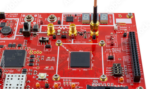 Differential Power Analysis (DPA) target board with FPGA target. Connected to SMA cable. Common Criteria, FIPS, cryptography testing. photo