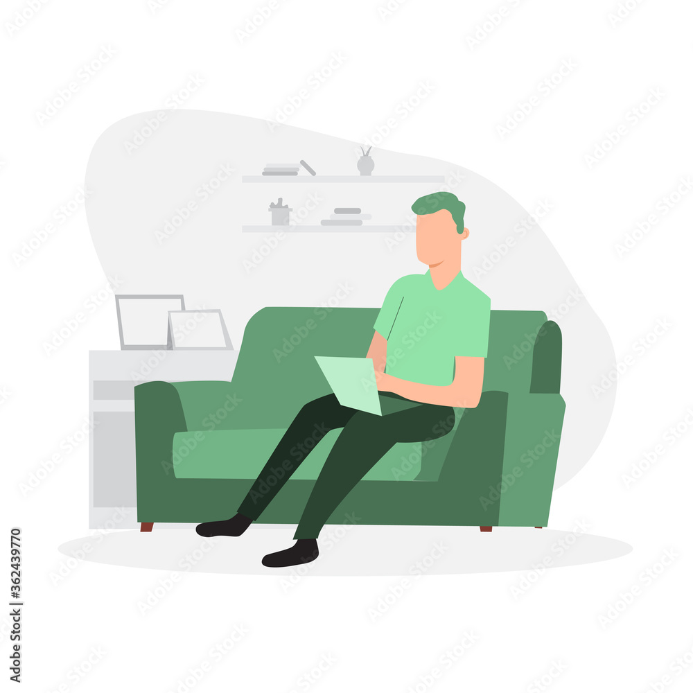 Man sitting on the sofa and working on laptop