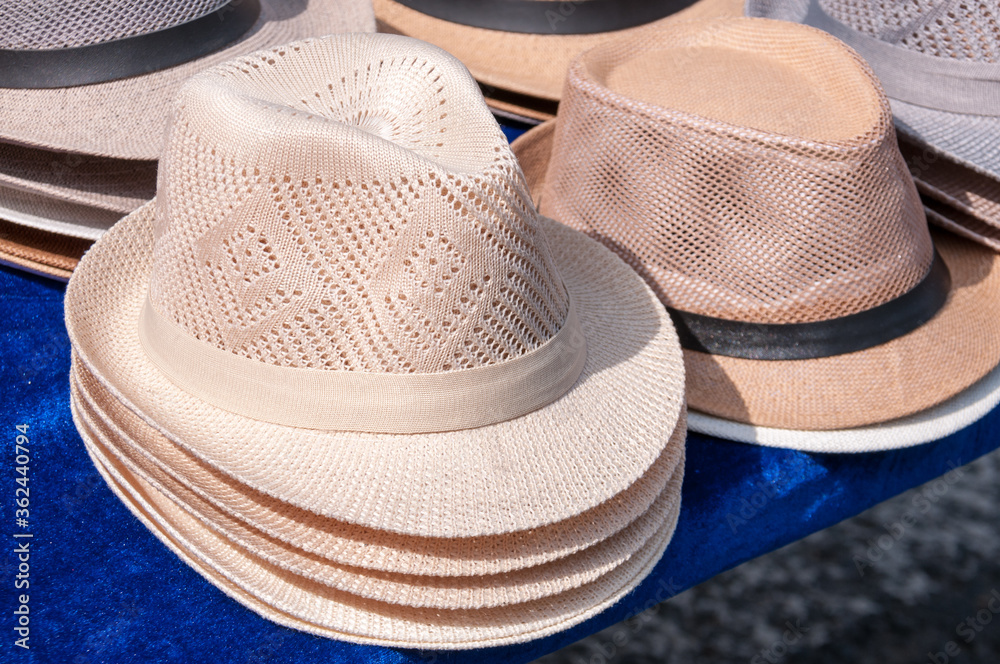 China, Heihe, July 2019: sale of men's hats at the market in Heihe in the summer