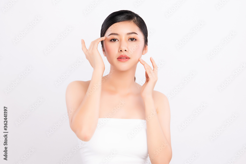 Beautiful Young asian Woman touching her clean face with fresh Healthy Skin, isolated on white background, Beauty Cosmetics and Facial treatment Concept,