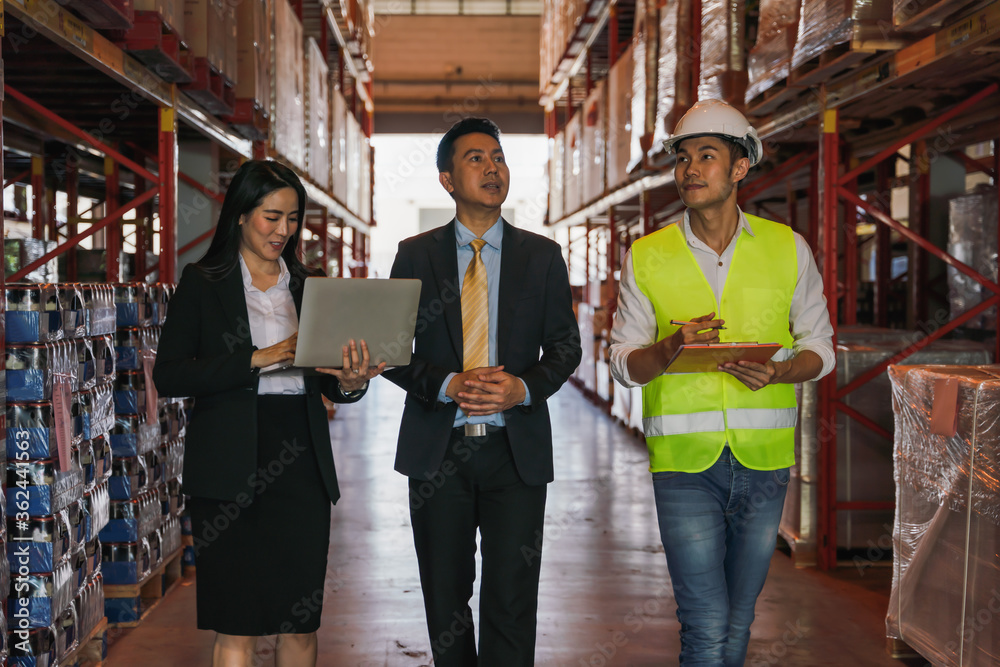 business people have business discussion in factory warehouse