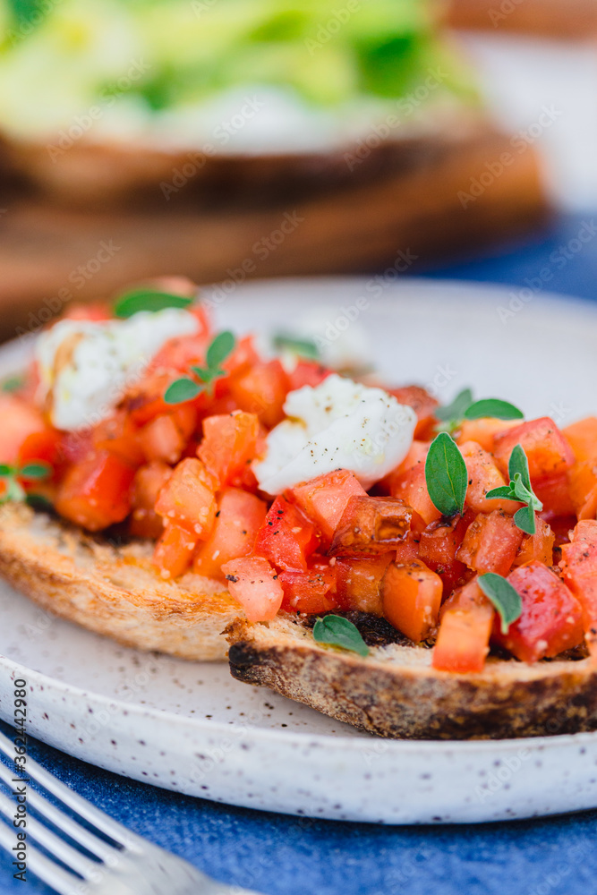 Tomato bruschetta with balsamic vinegar and bufala mozzarellaTomato