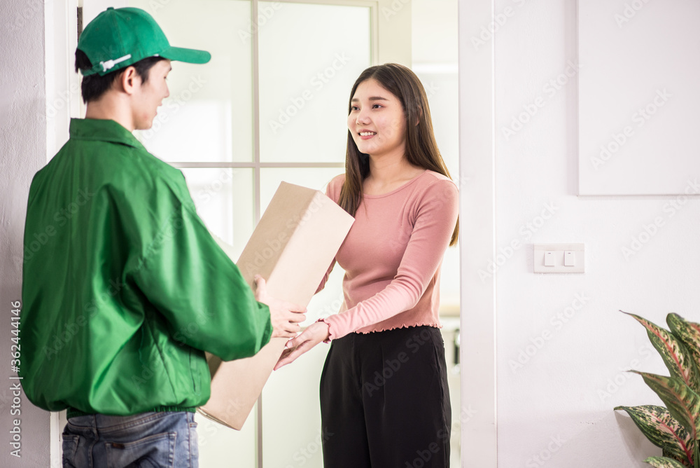 A man a medical mask and with a box, a parcel in his hands. A man a medical mask and with a box, a parcel in his hands.