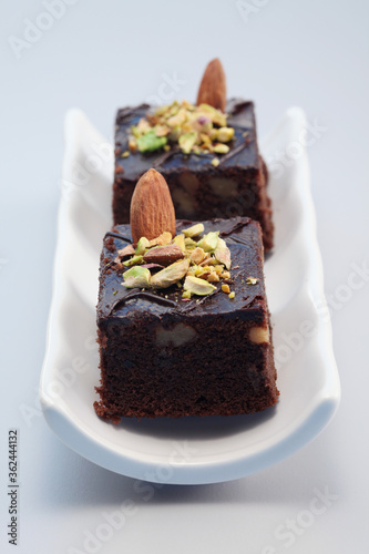 Brownie with almond and pistachio nut toppings
