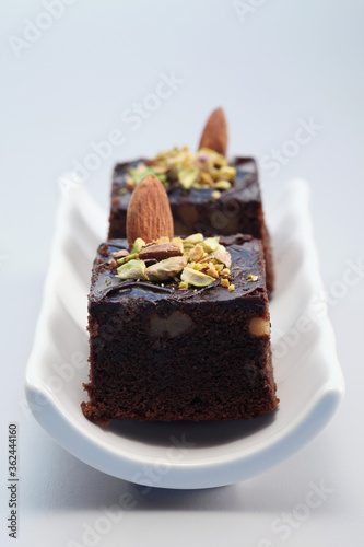 Brownie with almond and pistachio nut toppings