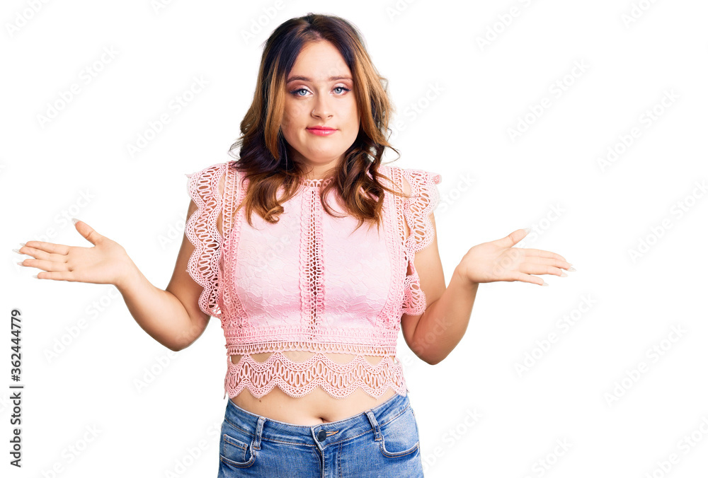 Young beautiful caucasian woman wearing casual clothes clueless and confused expression with arms and hands raised. doubt concept. Young beautiful caucasian woman wearing casual clothes clueless and confused expression with arms and hands raised. doubt concept.