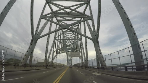 PANAMA CITY, PANAMA - JUNE 20, 2020: POV of road traffic on the bridge of the Americas entrance to the Panama Canal in the west of Panama city.