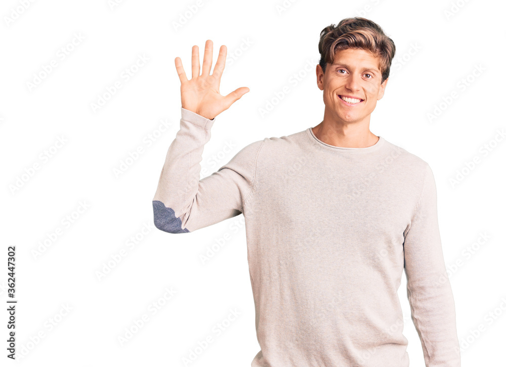 Young handsome man wearing casual clothes showing and pointing up with fingers number five while smiling confident and happy. Young handsome man wearing casual clothes showing and pointing up with fingers number five while smiling confident and happy.