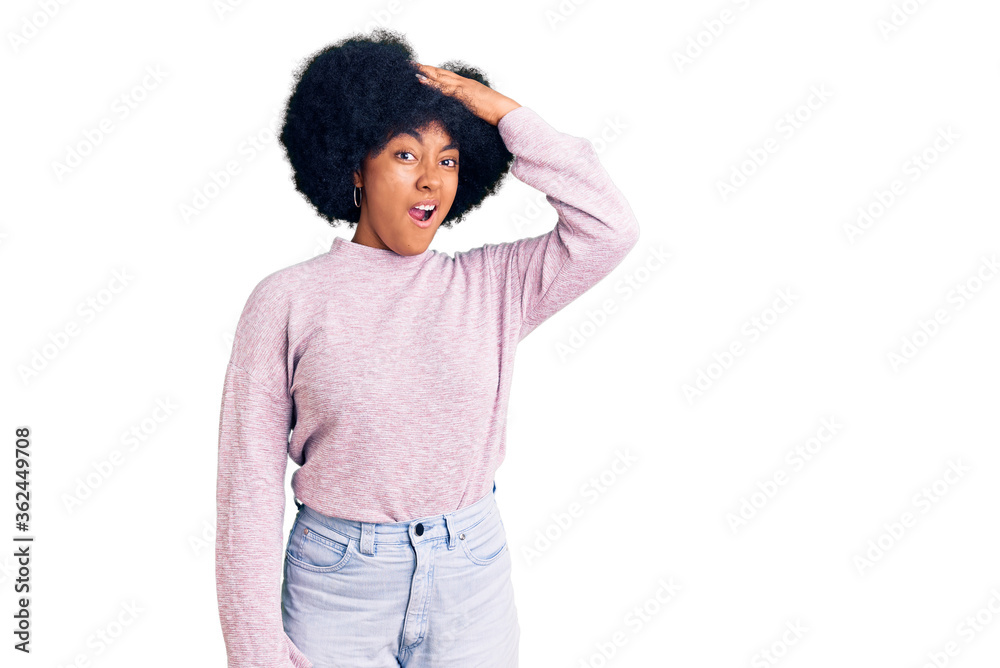 Young african american girl wearing casual clothes surprised with hand on head for mistake, remember error. forgot, bad memory concept. Young african american girl wearing casual clothes surprised with hand on head for mistake, remember error. forgot, bad memory concept.