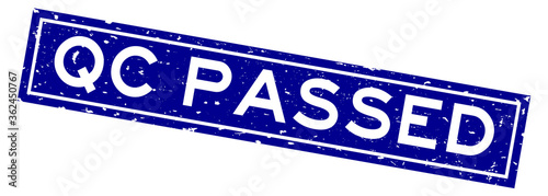 Grunge blue QC (Quality control) passed word square rubber seal stamp on white background