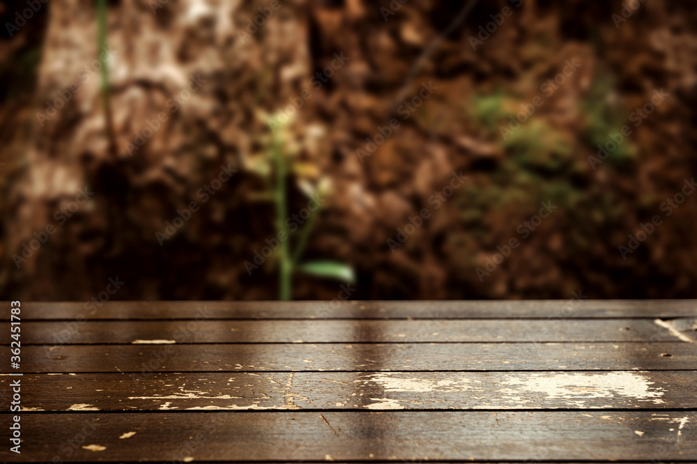 Wood floor perspective view with wooden texture in light brown color with green leaf background Wood floor perspective view with wooden texture in light brown color with green leaf background