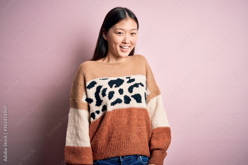 Young beautiful woman wearing fashion urban clothes, model wearing casual street style standing over pink background Young beautiful woman wearing fashion urban clothes, model wearing casual street style standing over pink background
