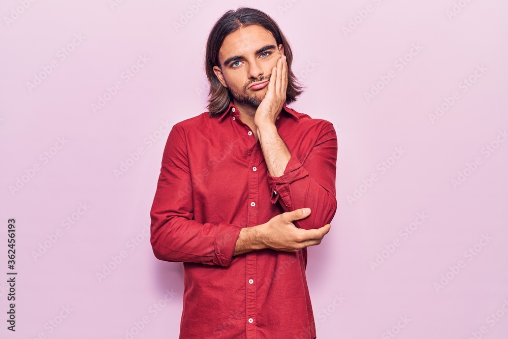 Young handsome man wearing business clothes thinking looking tired and bored with depression problems with crossed arms. Young handsome man wearing business clothes thinking looking tired and bored with depression problems with crossed arms.