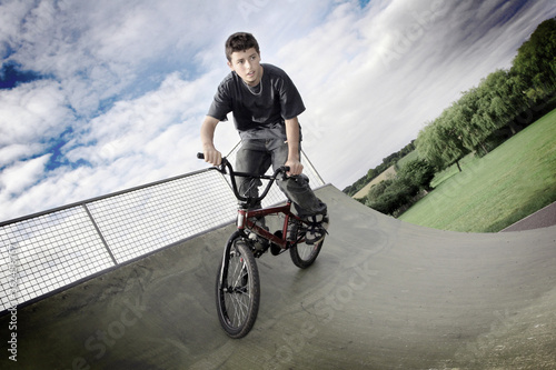 A boy cycling in a skateboard park © ImageHit