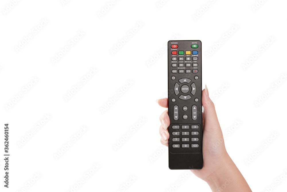 Woman hand holding TV remote control isolated Woman hand holding TV remote control isolated