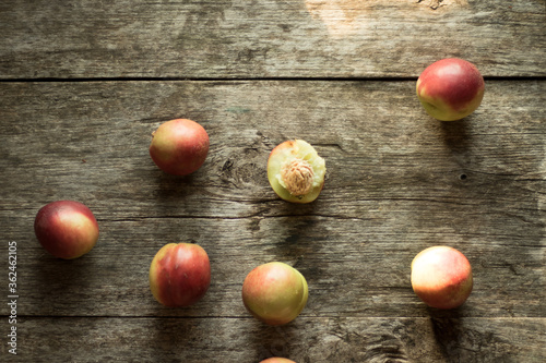 Nectarines lie on a wooden table. Conservation for the winter. Rustic design, minimalism.