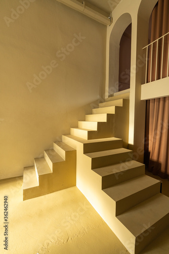 Minimal empty space scene with yellow stair and wall in shade for photoshoot / studio concept / mustar yellow theme / outdoor studio / modern minimal style