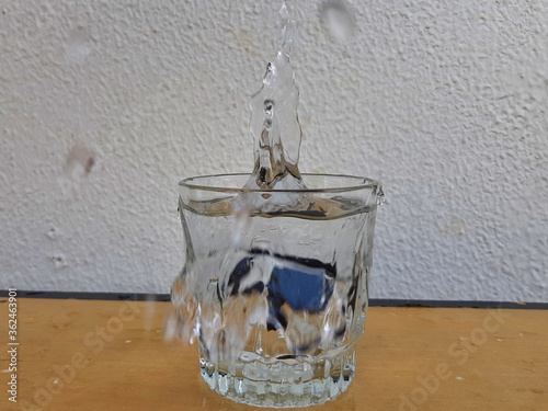 Water splashes coming out of glass 