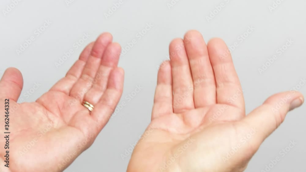 Two open palms repeatedly make the sign to come closer . Two open palms repeatedly make the sign to come closer .