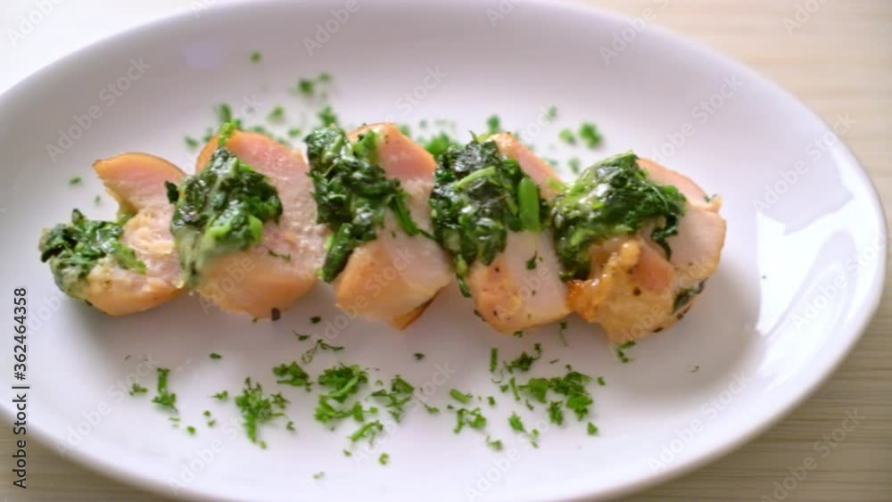 Chicken breasts stuffed with spinach and cheese on plate Chicken breasts stuffed with spinach and cheese on plate