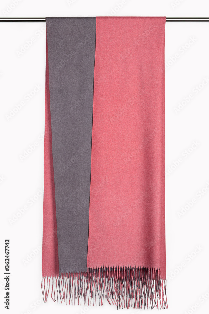 Fototapeta premium Cashmere two-tone scarf, stole with fringe on hanger.