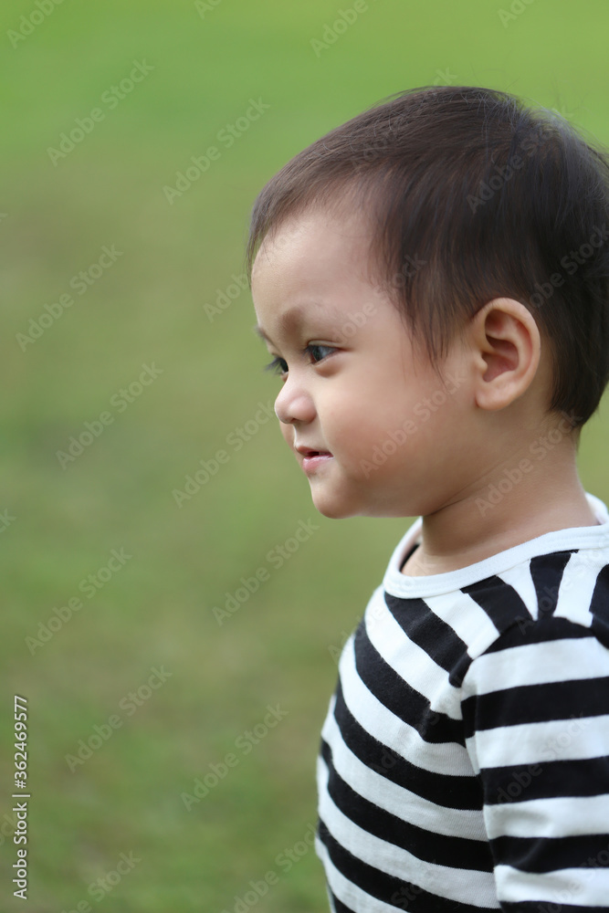 Asian boy is learning to walk in the garden. Asian boy is learning to walk in the garden.